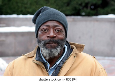 Bearded Homeless Man With Hat And Coat