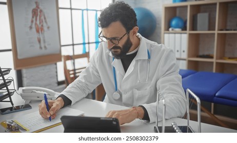 A bearded male doctor writing notes in a hospital room, epitomizing age, experience, and healthcare professionalism. - Powered by Shutterstock