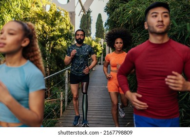 Bearded Man With Artificial Leg Running With His Multiracial Friends Outdoor