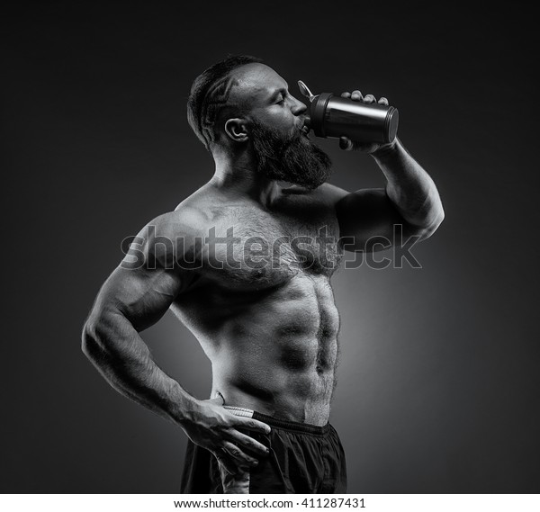 Bearded Man Bodybuilder Posing On Gray Stock Photo Edit Now Images, Photos, Reviews