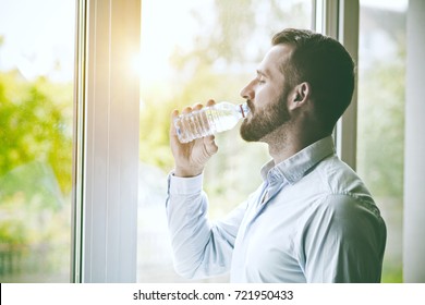 Bearded Man Drinking Bottle Of Water