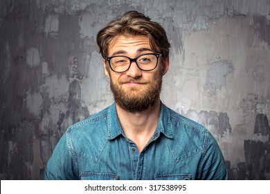 Bearded man with an expression of discontent on his face - Shutterstock ID 317538995