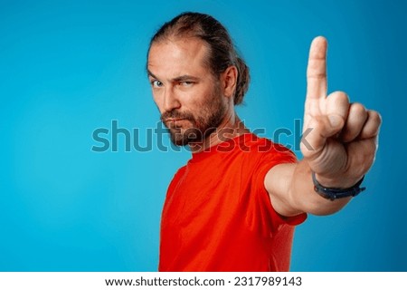 Bearded man gesturing stop or wait a minute