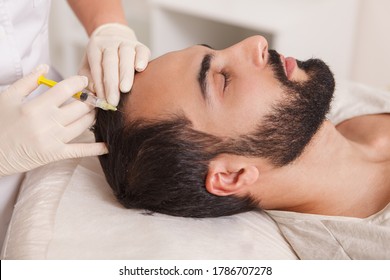 Bearded Man Getting Anti Hair Loss Treatment By Beautician