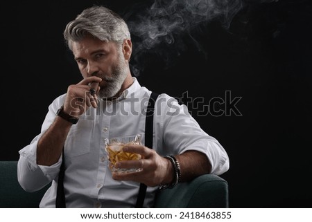 Similar – Image, Stock Photo Businessman smoking cigar in street cafe