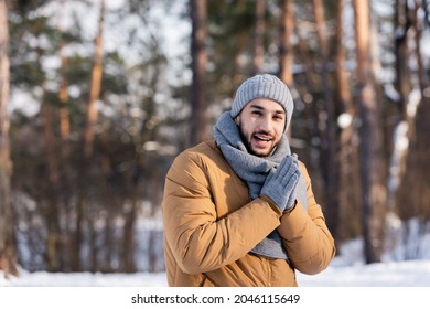 Bearded Man In Gloves And Hat Smiling At Camera In Winter Park