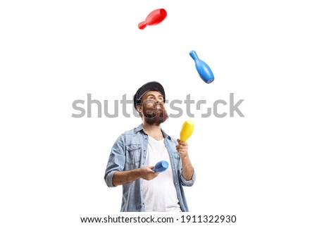 Bearded man juggling with clubs isolated on white background