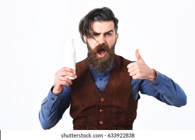 Bearded Man, Long Beard, Brutal Caucasian Hipster With Moustache Holding Bottle Of Kefir Or Yoghurt With Angry Face Isolated On White Background