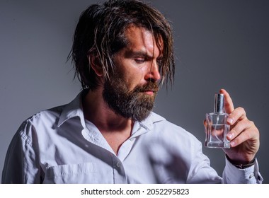 Bearded Man With Perfume Or Cologne Bottle. Male Fragrance And Perfumery. Mens Cosmetics.