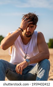 Bearded Man Sitting On The Beach