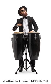 Bearded man in a suit playing conga drums isolated on white background