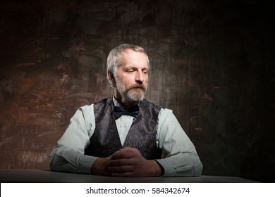 The bearded man at the table - Shutterstock ID 584342674