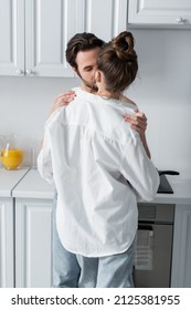 Bearded Man Taking Off White Shirt On Girlfriend