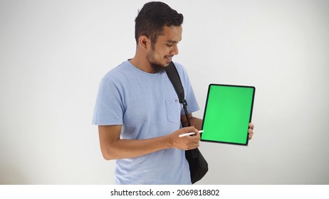 Bearded Man Using Bag Looking At Green Screen Tablet Isolated Gray Background