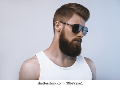 Bearded Man Wearing Sunglasses. Studio Shot On White Background