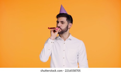 Bearded Man In White Shirt Blowing In Party Horn Isolated On Yellow