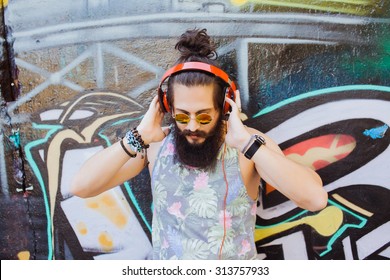 Bearded Man,lifestyle Portrait Of Hipster Man,cool Beard.Mans Hairstyle.haircut,hairdresser.Stylish Man Posing With Cool Hairstyle,wall,ready To Car Trip.Happy  Active,NYC,California,east Coast.Hiker 