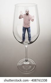 A Bearded Middle-aged Man Trapped In A Glass