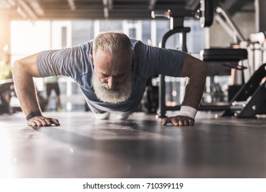 Bearded Old Pensioner Male Is Having Workout In Gym