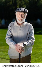 Bearded Senior Man In Flat Cap Holding Golf Club