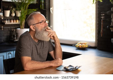 Bearded Senior Man Smoking Marijuana (weed, Cannabis) At Home.