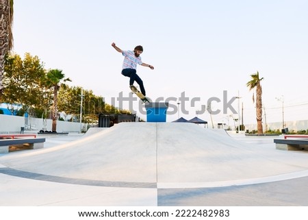 Similar – Image, Stock Photo Young bearded skater performing trick in skatepark