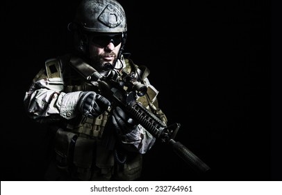 Bearded special forces soldier on dark background