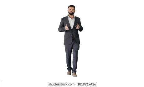 Bearded turk businessman walking and talking to camera on white - Shutterstock ID 1819919426
