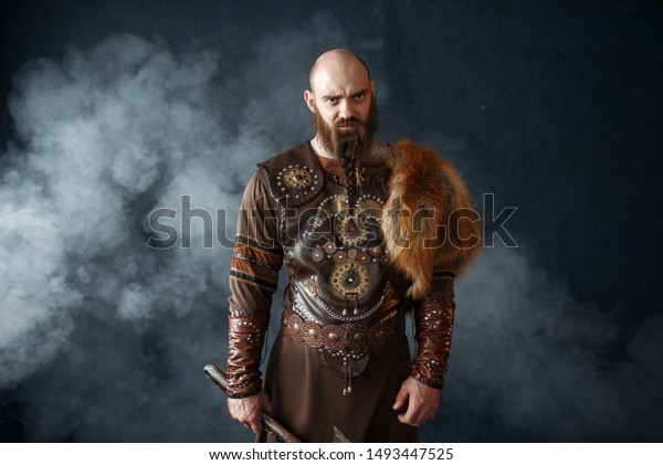 Bearded viking with axe,\
barbarian image
