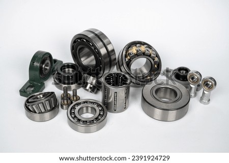 bearings of different types on a white background, ball bearing, roller bearing, pivot head, double-row roller bearing, bearing in housing, conical roller