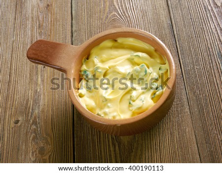 Bearnaise sauce  -  sauce made of clarified butter emulsified in egg yolks.