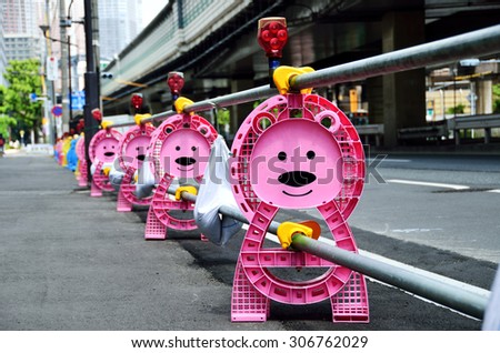 Bear-shaped post of barricade at construction site, Japan