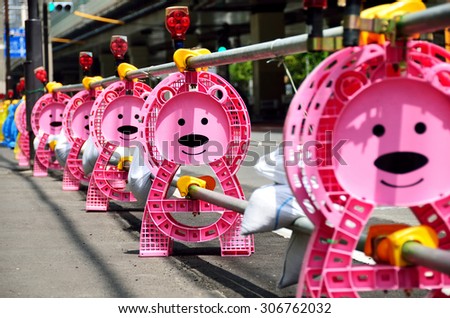 Bear-shaped post of barricade at construction site, Japan