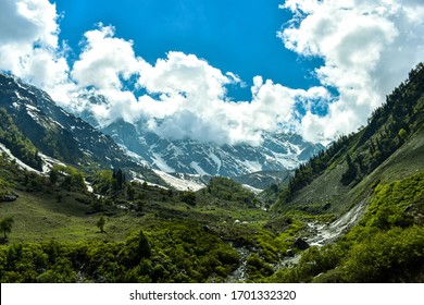 Beas Kund is situated at 12,140 ft. Above sea level in Kullu valley. Grasslands and snow-covered mountains of Pir Panjal range envelop this glacial lake. The trek starts from Dhundi (21kms from Manali - Shutterstock ID 1701332320