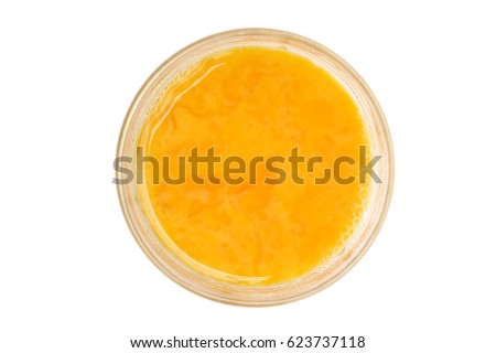 beaten egg in glass cup isolated on white background