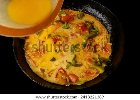 Beaten eggs and vegetables are used to make this frittata.