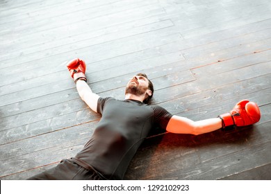 Beaten Man Lying On The Floor Of The Boxing Ring During The Knockout