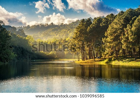 Beatiful nature lake and forest , Pang oung lake and pine forest in Mae Hong Son , Thailand , nature landscape of Thailand . Pang oung is popular travel destination in Thailand
