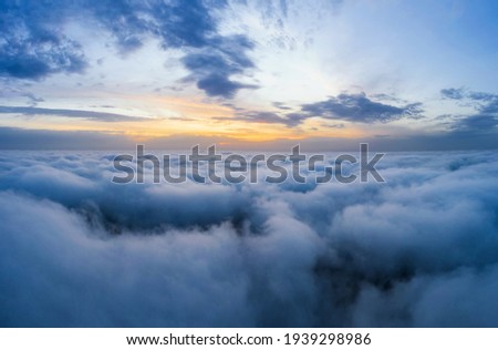 Beatuful dawn sky over clouds high. Aerial cloudscape photography.