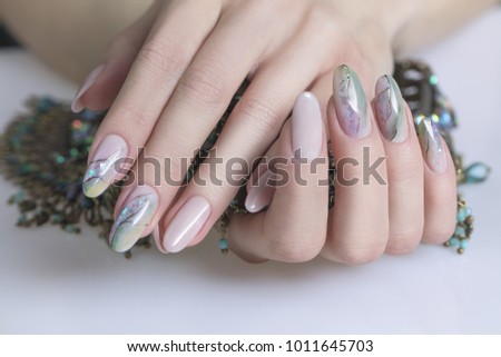 Beau tiful female hands with manicured nails. Beautiful Nail Art Manicure. Nail designs with decoration