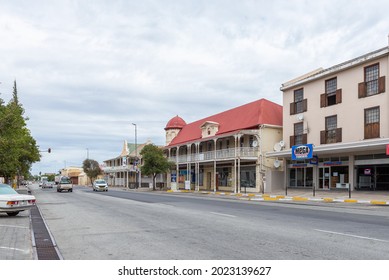 BEAUFORT WEST, SOUTH AFRICA - APRIL 2, 2021: A street scene in Beaufort West in the Western Cape Karoo. Vehicles and buildings are visible