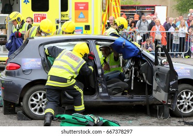 Beaulieu, Hampshire, UK - May 29 2017: Firemen And Paramedics At Work  During A Vehicle Rescue Demonstration By The UK Emergency Services