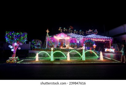 BEAUMONT HILLS, AUSTRALIA - DECEMBER 24, 2015;  Christmas Lights Decorations On House  Draw Crowds Of Visitors Each Year.  The Christmas Display Raise Money For Charity By Donations Of Visitors. 