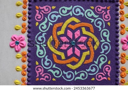 Beauriful rangoli patterns in square shape. Rangoli designs made with rangoli powder