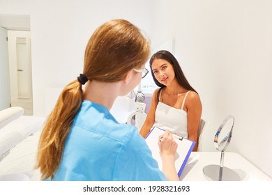 Beautician In Consultation Before Cosmetic Surgery Or At The Dermatologist