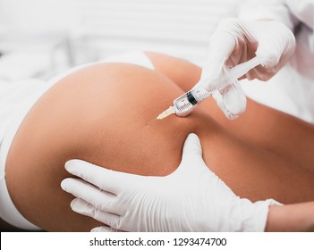 Beautician Doing Injection Into Female Buttocks, Body Mesotherapy