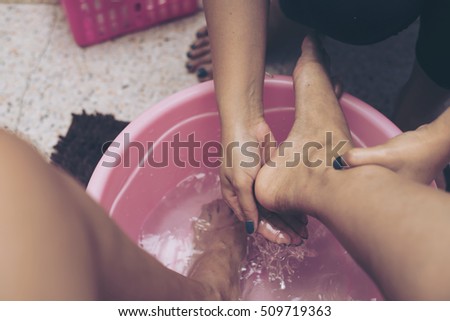 Beautician filing female clients feet spa beauty salon. for manicure and pedicure.