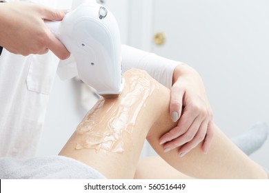 Beautician Giving Epilation Laser Treatment To Woman On Thigh - Shutterstock ID 560516449
