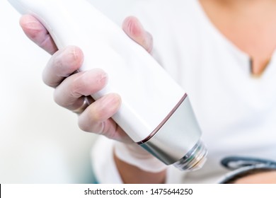 Beautician Holding Radio Frequency Microneedling Hand Piece. Used For Skin Tightening And Cosmetic Treatments In Spas, Salons And Laser Clinics.