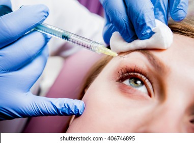 Beautician and the patient in the clinic of aesthetic medicine. The injection.